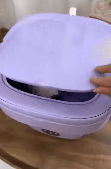 Foldable mini laundry machine by Bloom Mart, shown in a compact, portable design suitable for small spaces and easy storage.