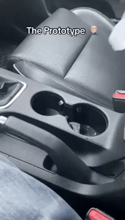 Smart car cup warmer from My Store, shown plugged into a car's cigarette lighter, keeping a beverage warm during travel.