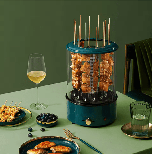 Electric rotating grill by Bazaar E Arab with a stainless steel finish, featuring a rotating cooking surface and adjustable settings.