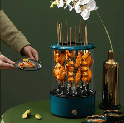 Bazaar E Arab electric rotating grill with stainless steel body and rotating skewers for even cooking.