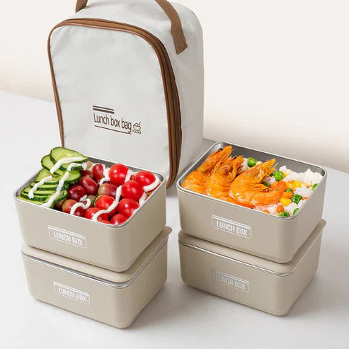 Insulated lunch box set with matching carry bag, featuring multiple compartments and a sturdy handle for easy carrying.